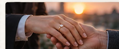 Close detail of two hands together at sunset