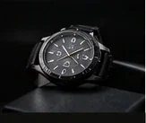 Luxury watch photographed on a dark background